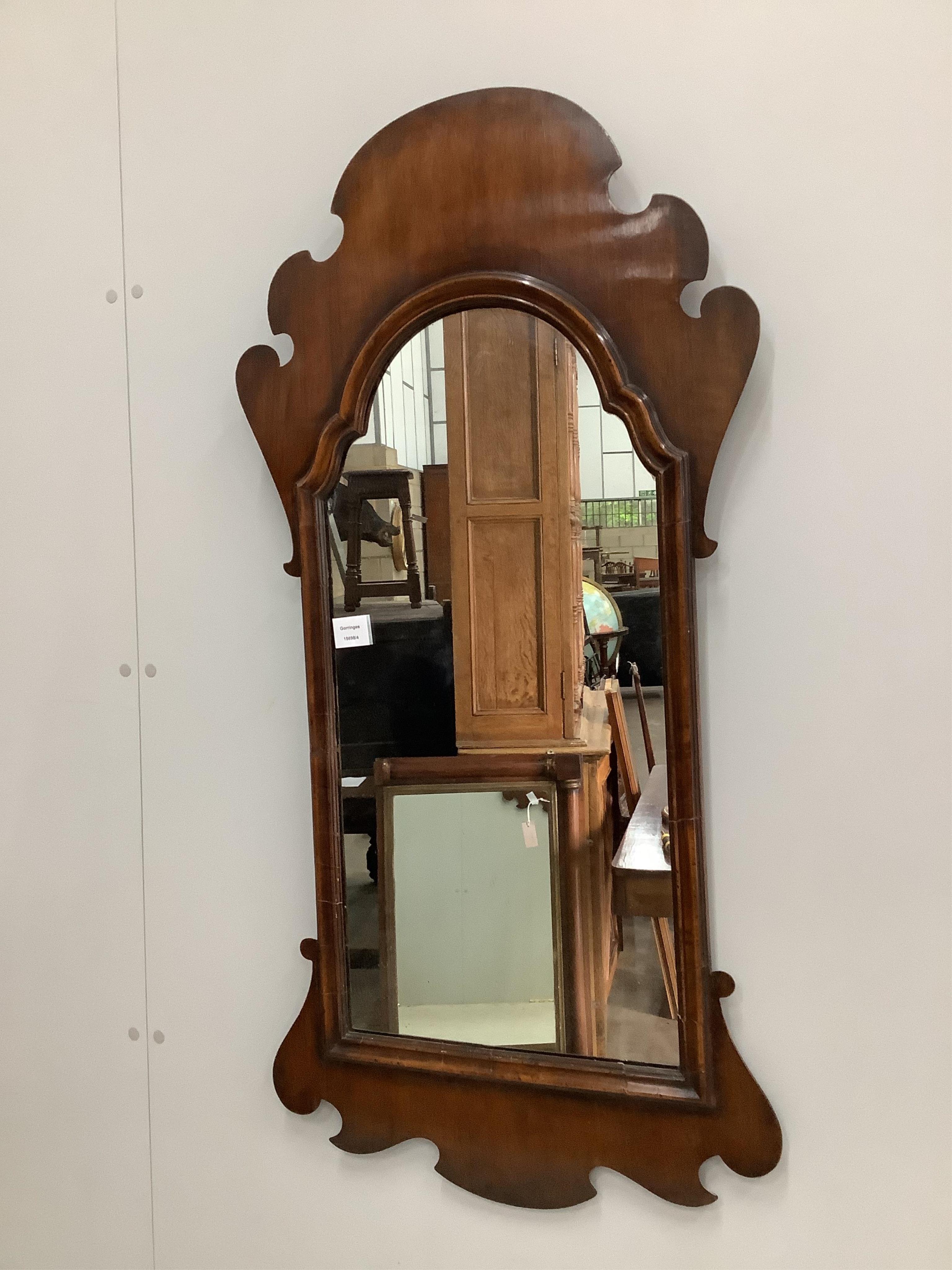 A George I style walnut fret framed wall mirror, width 55cm, height 113cm. Condition - fair to good